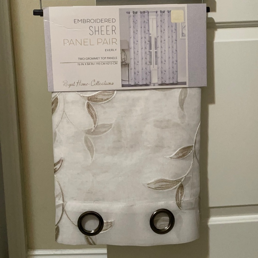 Two grommet top panel sheer curtains